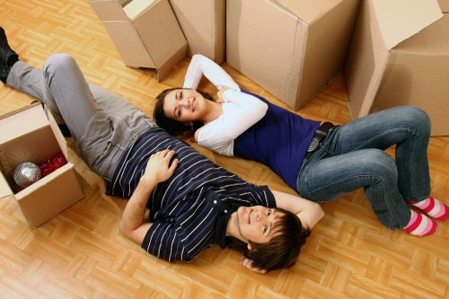 Professional moving team and removal truck with Waterloo skyline in the background
